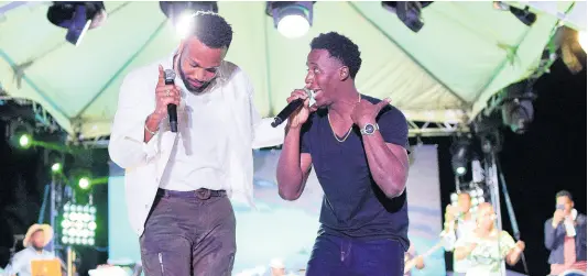  ??  ?? Agent Sasco calls Romain Virgo onstage to give the fans a special performanc­e of ‘Dutty Heart’.