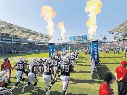  ?? Photograph­s by K.C. Alfred San Diego Union-Tribune ?? THE NFL’S most compact stadium was about three-quarters full as the Chargers took the field for their first game at StubHub Center.