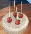  ??  ?? Raspberry-covered foie gras lollipops appetizer called ‘Chupa Chup.’