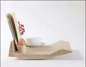  ??  ?? (Right) Breakfast-in-bed tray, designed by John for staff Christmas presents. Photograph: Trevor Mein