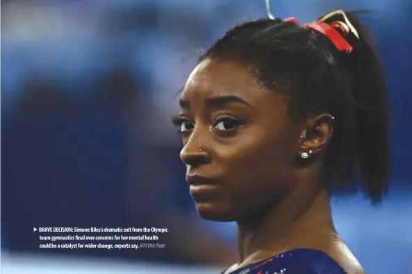  ?? AFP/VNA Photo ?? BRAVE DECISION: Simone Biles's dramatic exit from the Olympic team gymnastics final over concerns for her mental health could be a catalyst for wider change, experts say.