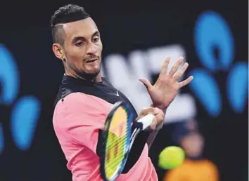 ?? AFP ?? Australia’s Nick Kyrgios hits a forehand return to Serbia’s Viktor Troicki during their men’s singles second round match on day three of the Australian Open yesterday.