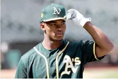  ?? AP Photo/Jeff Chiu ?? ■ Oakland Athletics draft pick Kyler Murray looks on before a baseball game between the Athletics and the Los Angeles Angels on June 15, 2018, in Oakland, Calif. On the day the A’s started spring training workouts, Murray said he will pursue a career in the NFL.