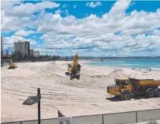  ?? Picture: GLENN HAMPSON ?? Diggers tear up the dunes at Greenmount to supply sand to beach volleyball courts.