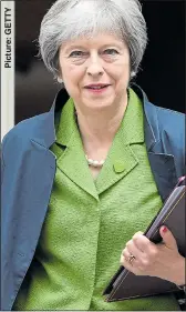  ??  ?? FIGHTING: Theresa May yesterday