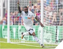  ??  ?? ■ Swansea’s Jordan Ayew celebrates his goal.