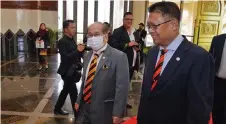  ?? ?? Julaihi (right) arrives at the DUN Complex for the sitting, together with Deputy Premier Datuk Amar Douglas Uggah.