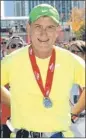  ??  ?? Marvin Jansen at the finish of the 2011 Chicago Marathon.