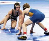  ??  ?? Schuylervi­lle junior Orion Anderson stalks Phoenix sophomore Cahal Donovan during their Division II 120-pound semifinal Saturday afternoon at the Times Union Center in Albany.