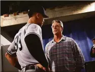  ?? Vaughn Ridley / Getty Images ?? The Yankees’ Aaron Judge, left, speaks to Roger Maris Jr. following Wednesday’s win against the Blue Jays in Toronto.