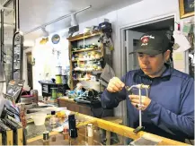  ?? THOM COLE/THE NEW MEXICAN ?? Norman Maktima, senior fly-fishing guide at High Desert Angler in Santa Fe, monitors the snowpack and weather forecasts because of what they could mean for spring and summer stream conditions. He was tying flies at the store Wednesday.