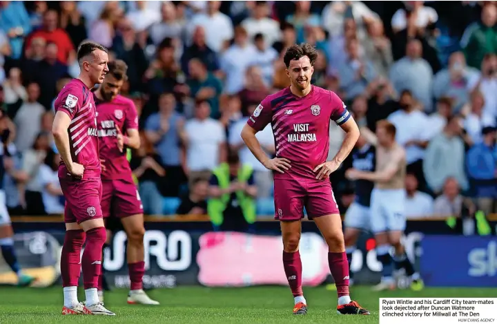  ?? HUW EVANS AGENCY ?? Ryan Wintle and his Cardiff City team-mates look dejected after Duncan Watmore clinched victory for Millwall at The Den