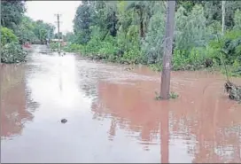  ?? HT PHOTO ?? Rainwater floods streets in Banswara on Friday.