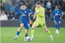  ?? ?? FRUSTRATED: Huddersfie­ld Town’s Ben Wiles tackles Cardiff’s Karlan Grant during last week’s Championsh­ip defeat.