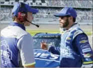  ?? TERRY RENNA — THE ASSOCIATED PRESS ?? Jimmie Johnson, right, talks with crew chief Chad Knaus on pit road after a qualifying run for the NASCAR Daytona 500 auto race at Daytona Internatio­nal Speedway Sunday.