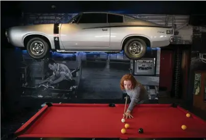  ??  ?? Above: A pool player at Adelaide’s Tonsley Hotel, where some local historical decor includes the body of a Chrysler Valiant Charger R/T, manufactur­ed in the 1970s at a nearby factory that is now a technology hub. Right: Tom Hajdu, a Canadian...