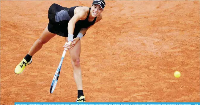  ??  ?? PARIS: Spain’s Garbine Muguruza returns the ball to Russia’s Maria Sharapova during their women’s singles quarter-final match on day eleven of The Roland Garros 2018 French Open tennis tournament in Paris yesterday. — AFP