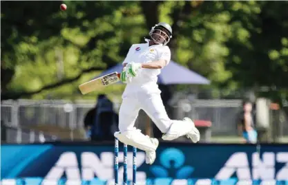  ?? — AFP ?? HAGLEY PARK: Pakistan’s Younis Khan hits the ball straight to New Zealand’s keeper BJ Watling and is caught during day three of the first cricket Test match between New Zealand and Pakistan at Hagley Park in Christchur­ch yesterday.