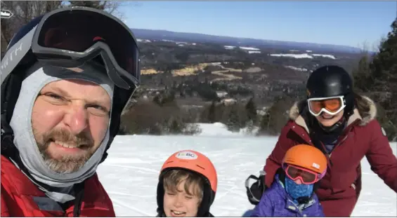  ?? LAURA GEIGER/SUBMITTED PHOTO ?? Scott and Laura Geiger seek out snowy activities for their daughters during the winter months.