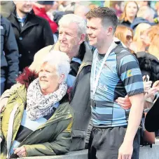  ??  ?? Fan-tastic Connor Wylie celebrates with supporters