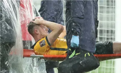  ?? ?? Harry Souttar of Australia is stretchere­d from the field during the World Cup qualifier againstSau­di Arabia. Photograph: Mark Metcalfe/ Getty Images