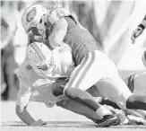  ?? RICH SCHULTZ/GETTY IMAGES ?? QB Jay Cutler assumes a familiar position against the Jets, having been sacked nine times this season.