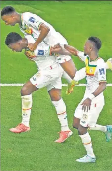  ?? AFP ?? Senegal's Bamba Dieng (L) celebrates after scoring against Qatar during their 3-1 win at the Al-Thumama Stadium in Doha on Friday.