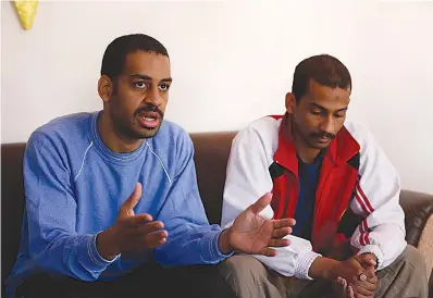  ?? AP Photo/Hussein Malla ?? ■ Alexanda Amon Kotey, left, and El Shafee Elsheikh, who were allegedly among four British jihadis who made up a brutal Islamic State cell dubbed “The Beatles,” speak during an interview with The Associated Press on Friday at a security center in...