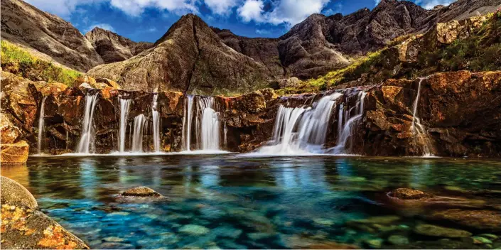  ??  ?? Perfect for proposals: The sparkling emerald Fairy Pools on Skye, off the west coast of Scotland, which was voted the most romantic place in Britain in a survey