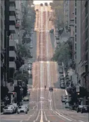  ?? AFP ?? California Street, usually packed with cable cars, is seen empty in n
San Francisco.