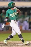  ?? Thearon W. Henderson / Getty Images ?? Tony Kemp was not happy with his performanc­e after the A’s extrainnin­g victory over the Red Sox.