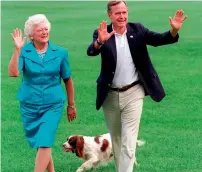  ?? AP ?? Barbara Bush and former president George W. Bush with their dog Millie in the South Lawn of the White House. —