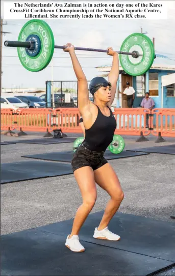  ?? ?? The Netherland­s’ Ava Zalman is in action on day one of the Kares CrossFit Caribbean Championsh­ip at the National Aquatic Centre, Liliendaal. She currently leads the Women’s RX class.