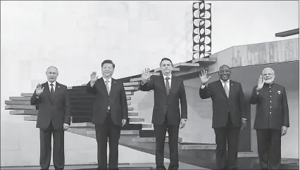  ?? -AFP ?? The BRICS leaders pose for a group photo at the 11th summit of BRICS in Brazil.