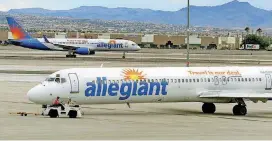  ?? [AP FILE PHOTO] ?? In this 2013 photo, two Allegiant Air jets taxi at McCarran Internatio­nal Airport in Las Vegas. Shares of Allegiant Air’s parent company tumbled Monday following a “60 Minutes” investigat­ion that expressed serious safety concerns about the airline.