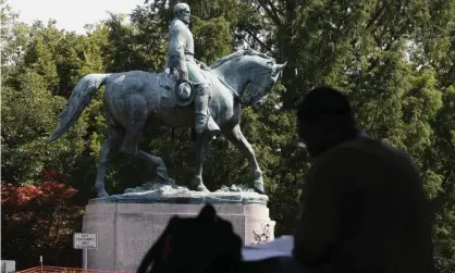  ??  ?? A statue of Robert E Lee in Charlottes­ville, Virginia. Photograph: Steve Helber/AP