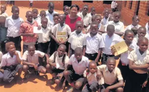  ??  ?? Some of the orphans being helped by Kalamba Donatien Kazadi and his wife Marie