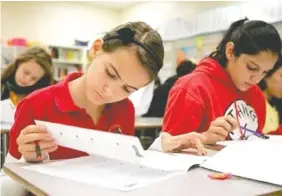  ?? PHOTO BY CHARLOTTE SOUTHERN/MIAMI HERALD/TNS ?? Language arts students at Carver Middle School in Miami-Dade County prepare for the state assessment­s. Across Florida, parents are pushing back on standardiz­ed tests. Some say schoolchil­dren are taking too many exams. Others have concerns about the...