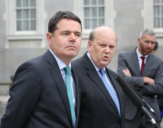  ??  ?? MONEY TALKS: Minister for Public Expenditur­e, Paschal Donohoe, and Finance Minister Michael Noonan, following the conclusion of the Cabinet meeting at Government Buildings after the EU Commission’s ¤13bn tax decision last week. Photo: Tom Burke