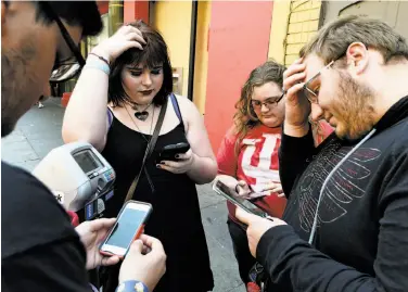  ?? Michael Noble Jr. / The Chronicle 2016 ?? Chastity Shilling (second from left), Sarah Ayers and Dylan Davis play “Pokémon Go” in S.F. last July. The blockbuste­r game hasn’t led to a new era in augmented reality gaming since it burst on the scene last year.