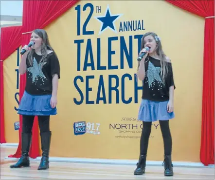  ??  ?? Talented singers: Emilie Mourie, left, and Peyton Morete, who reached the Shooting Star Talent Search junior final at the Porirua North Shopping Centre last year.