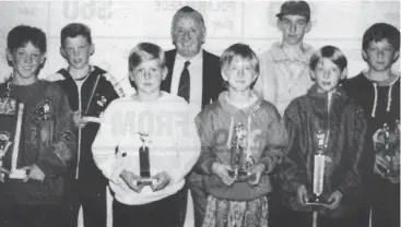  ??  ?? Frank Ahern (pictured in suit at back) coached Robert Murphy (left) to a best and fairest with the Colts in 1993. Other award winners were, from left Gareth Martin, Shane Ingham, Clint Madden, Simon Schreyer, Steven Mann and Stephen Johns; Absent:...