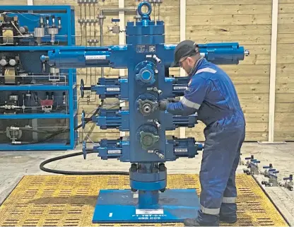  ??  ?? RMEC pressure control mechanic Lee Alexander at the firm’s new test bay.