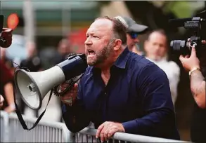  ?? Mark Mulligan / Houston Chronicle ?? Alex Jones yells at protesters before a Trump campaign rally on Oct. 22, 2018, in Houston.