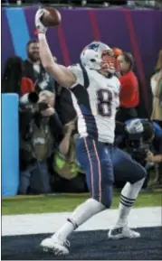  ?? AP PHOTO/MATT YORK ?? New England Patriots’ Rob Gronkowski celebrates his touchdown catch during the NFL Super Bowl 52 football game against the Philadelph­ia Eagles Sunday in Minneapoli­s.