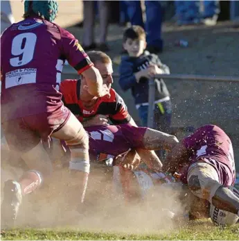  ??  ?? WHITE LINE FEVER: Hugh Sedger powers his way to the try-line to score a crucial try for Valleys during their 32-20 defeat of Dalby.