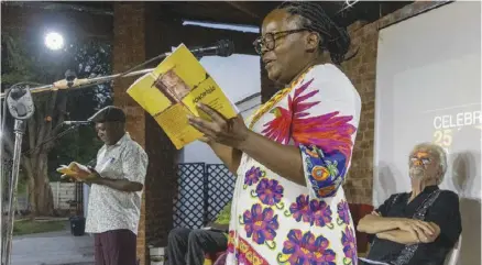  ?? ?? Petina Gappah (front) and Musaemura Zimunya read books while Murray Mccartney looks on. Pic: David Brazier.