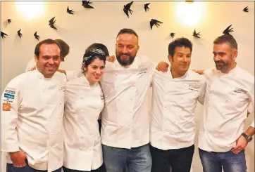  ?? PHOTO BY SAL PIZARRO ?? Five chefs from Michelin-starred Portuguese restaurant­s celebrate following dinner service during the San Jose Michelin AllStar Experience at Adega restaurant in San Jose on Wednesday. From left, David Costa and Jessica Carreira from Adega; Pedro Lemos...