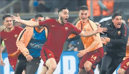  ?? AFP ?? Kostas Manolas (centre) celebrates after scoring the winners in Roma’s secondleg Champions League quarterfin­al against Barcelona at the Olympic Stadium on Tuesday.