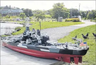  ?? JOE GIBBONS/THE TELEGRAM ?? Kurt Stokes has been building remote control vessels for more than 30 years. One is a model of the USS North Carolina. The actual vessel is now used as a museum in Wilmington, N.C. His replica was on display at Quidi Vidi Lake last week.